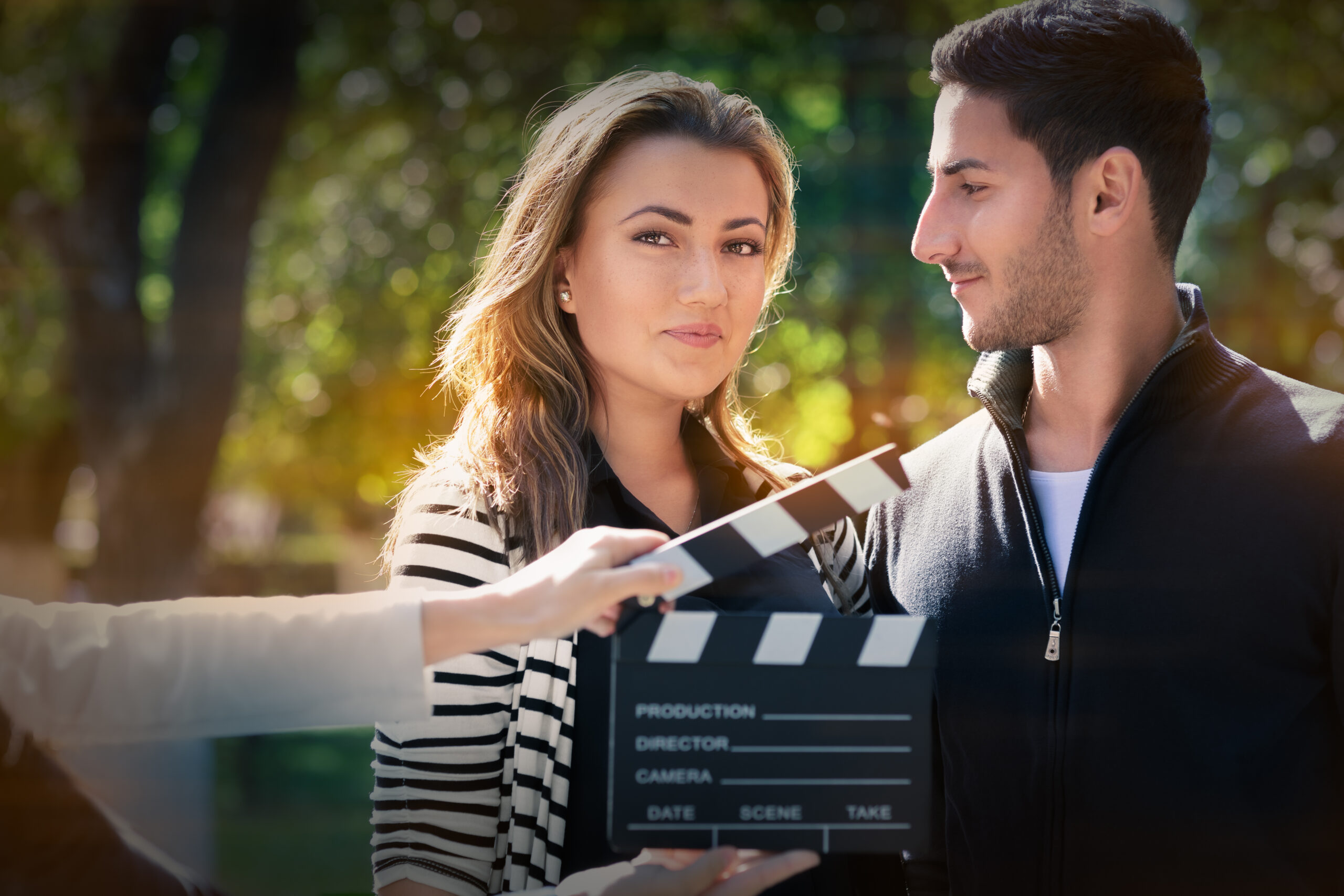 Young couple shooting a romantic scene outside